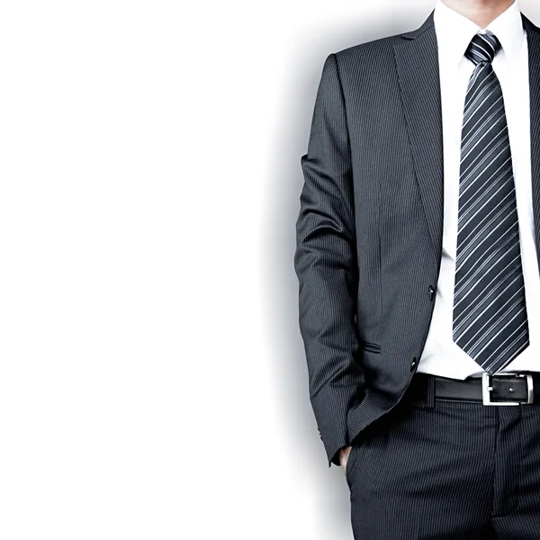 Businessman wearing suit & tie standing on white background — Stock Photo, Image