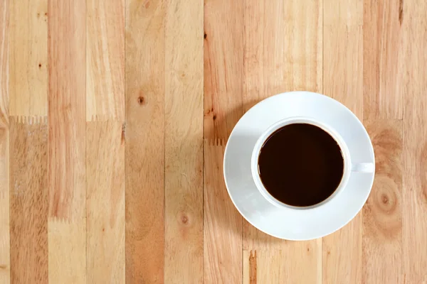 Taza de café en la mesa de madera, vista superior —  Fotos de Stock