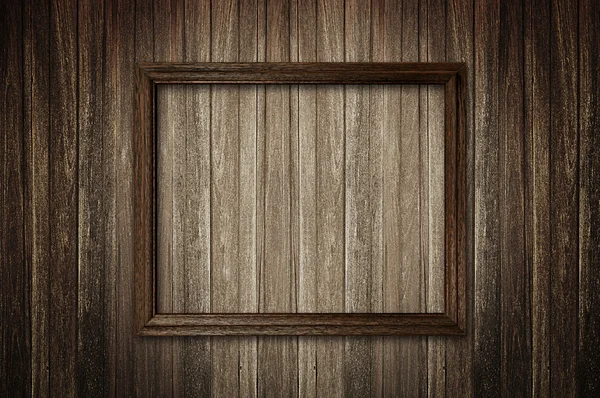 Picture frame on dark wooden wall — 图库照片