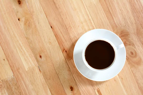 Taza de café en la mesa de madera, vista superior —  Fotos de Stock