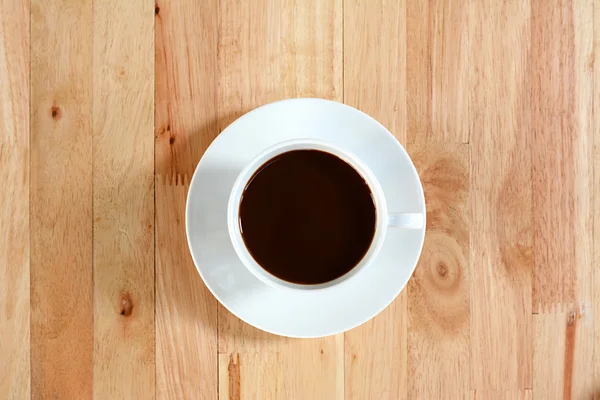 Taza de café en la mesa de madera, vista superior —  Fotos de Stock