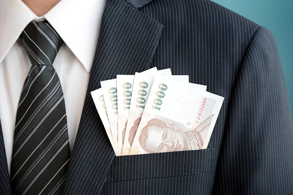 Dinero en el bolsillo del traje del hombre de negocios - Baht tailandés (THB) moneda —  Fotos de Stock