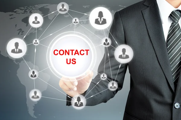 Businessman pointing on CONTACT US sign on virtual screen — Stock Photo, Image