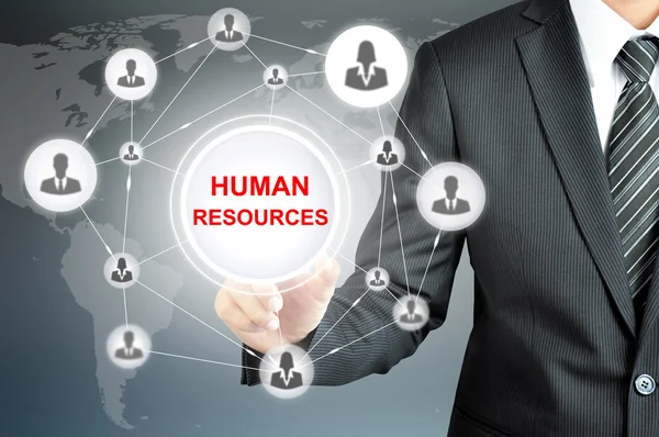 Empresario mano señalando RECURSOS HUMANOS firmar en pantalla virtual — Foto de Stock