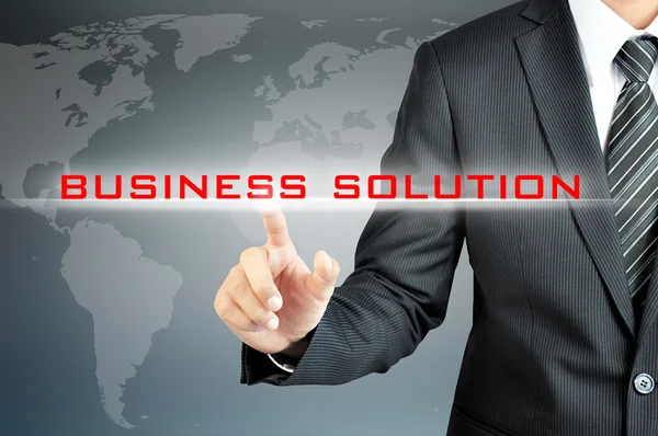 Рука бізнесмена торкається знака BUSINESS SOLUTION на віртуальному екрані — стокове фото