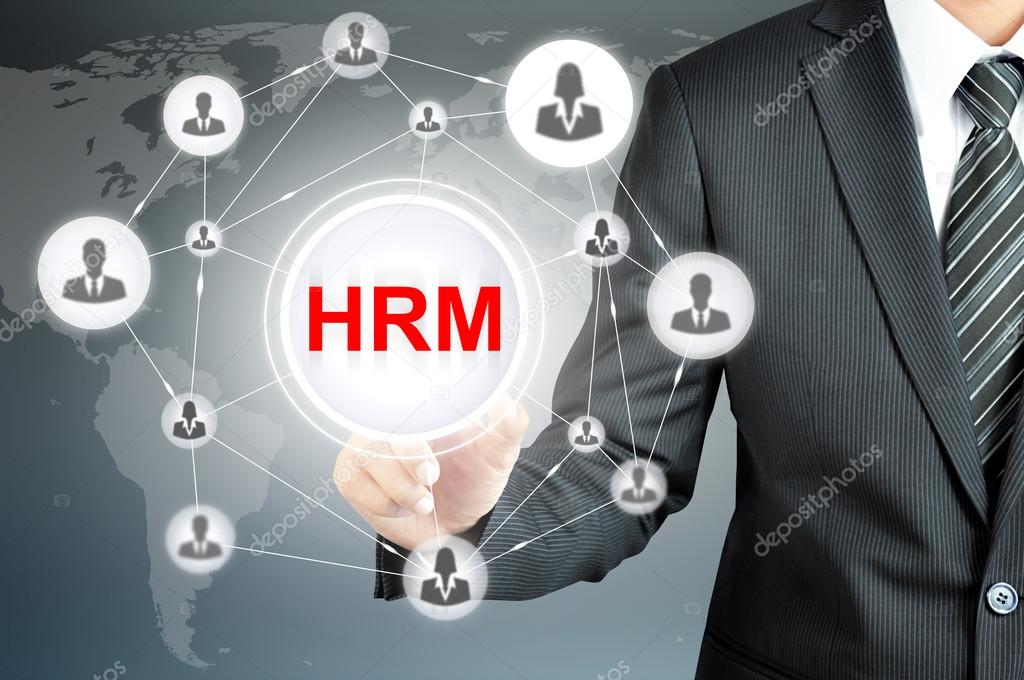 Businessman pointing on HRM (Human Resource Management ) sign