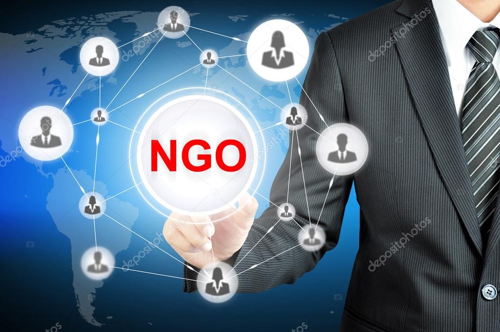 Businessman pointing on NGO (Non-Governmental Organization) sign on virtual screen