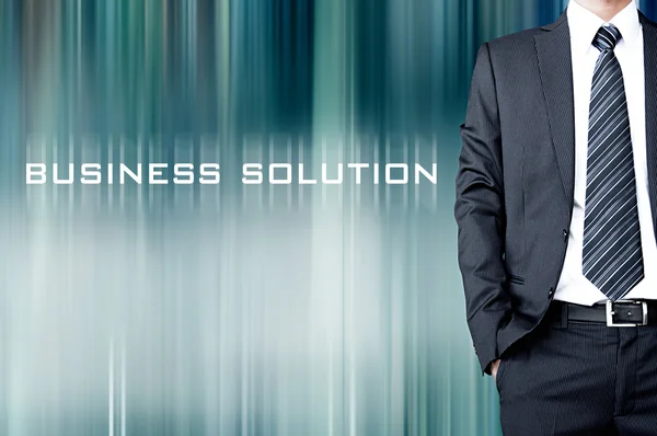 BUSINESS SOLUTION sign on motion blur abstract background with  standing businessman — Stock Photo, Image