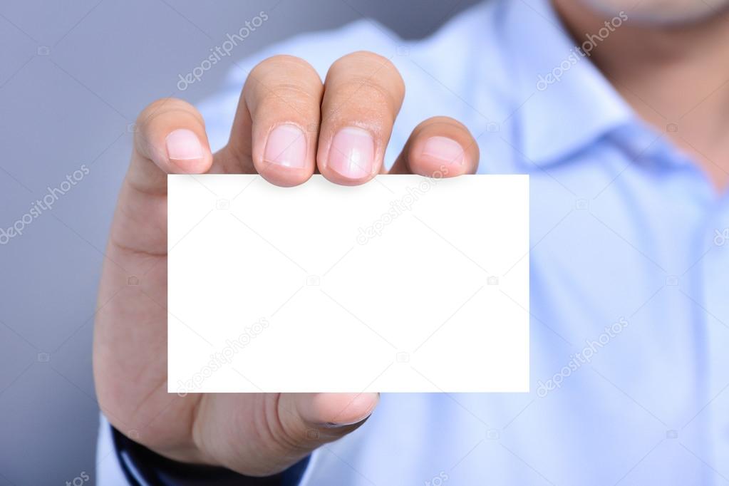 A man holding blank white card