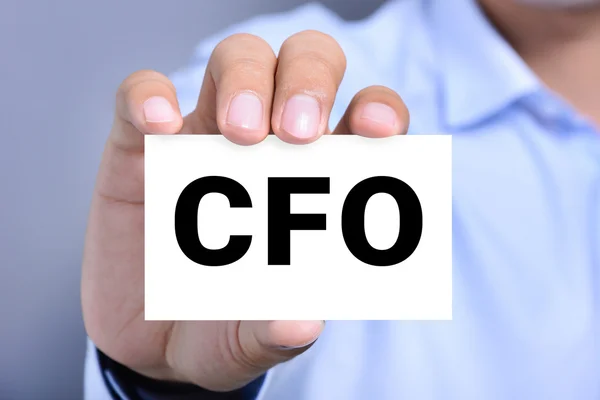 CFO letters (or Chief Financial Officer) on the card shown by a man hand — Stock Photo, Image