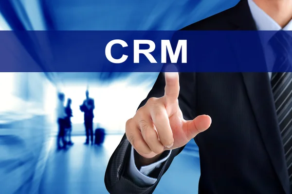 Mãos de empresário tocando CRM (ou Customer Relationship Management) guia na tela virtual — Fotografia de Stock