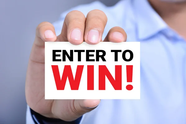 Enter To Win!, bericht op de kaart door een man hand — Stockfoto