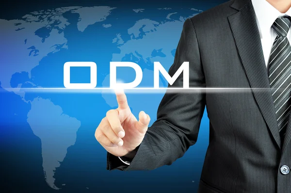 Geschäftsmann zeigt auf odm (original design manufacturer) Schild auf virtuellem Bildschirm — Stockfoto