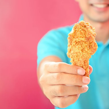 A man giving fried chicken leg or drumstick clipart
