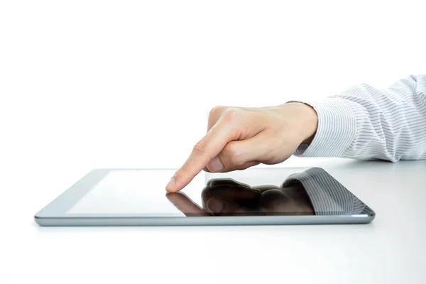 Hand touching tablet pc screen on the table — ストック写真