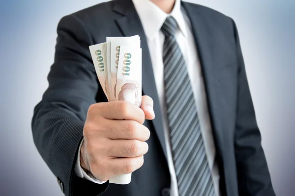 Businessman hand grabbing money - Thai Baht (THB) — Stock Photo, Image