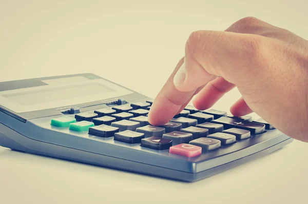 Fingers pressing on calculator keypad — Stock Photo, Image