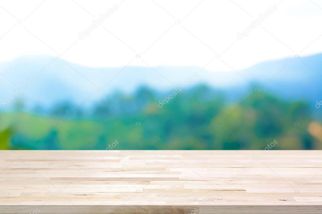 Wood table top on blur mountain background