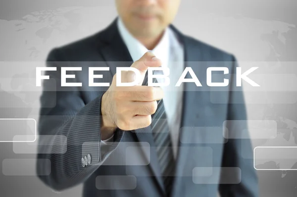 Businessman hand pointing on FEEDBACK word on virtual screen — Stock Photo, Image