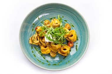 Mantar soslu ve roka aromalı Tortellini.