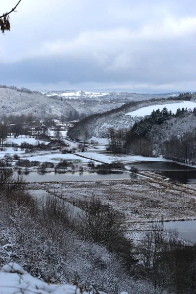 Panoramic view of the flooded plain in winter under the snow, in Saint-Pierre le Chastel, Auvergne