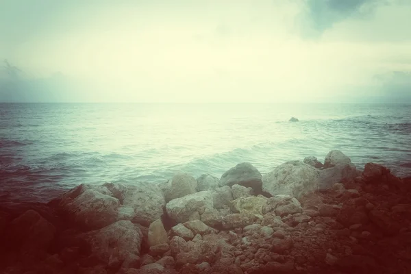 Sea and rocky coast in misty glow — Stock Photo, Image