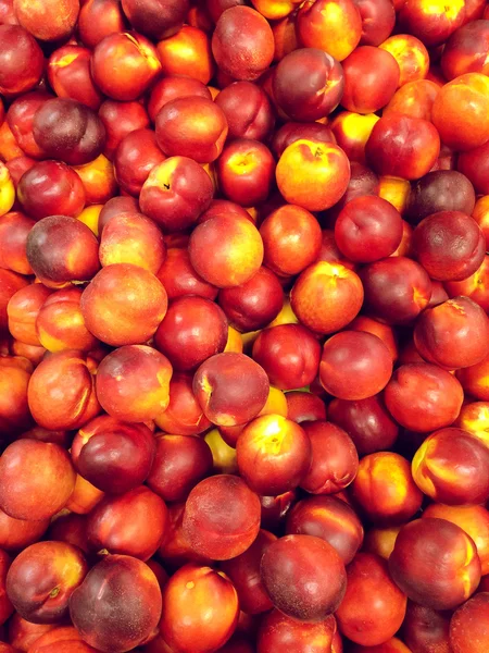 Red peaches background — Stock Photo, Image