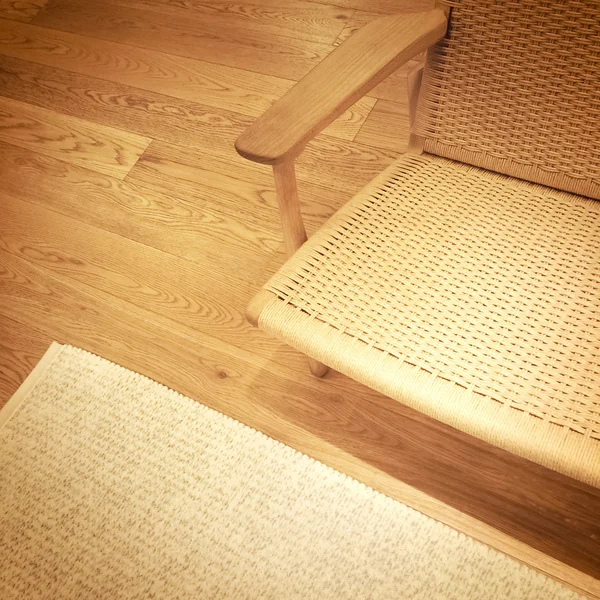 Rattanowe krzesło drewniane podłogi — Zdjęcie stockowe