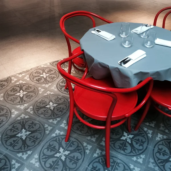 Interior with table and red chairs — Stock Photo, Image