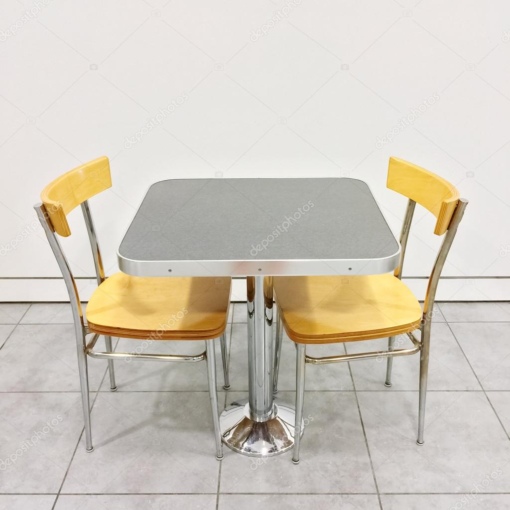 Table with two chairs in a cafeteria
