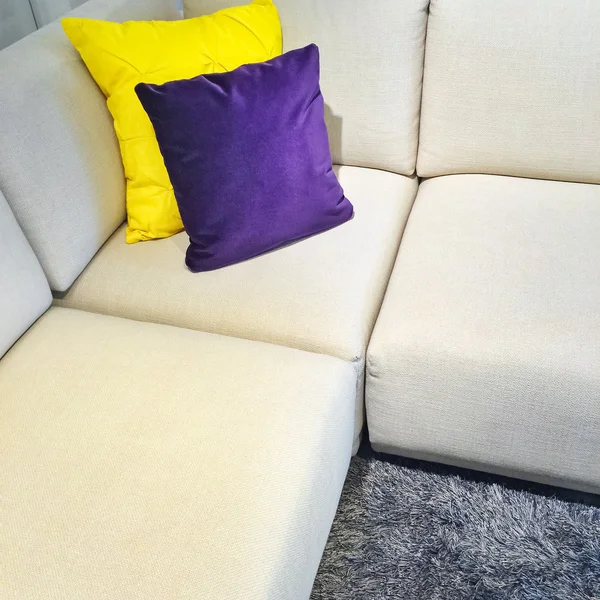 White corner sofa with colorful cushions — Stock Photo, Image