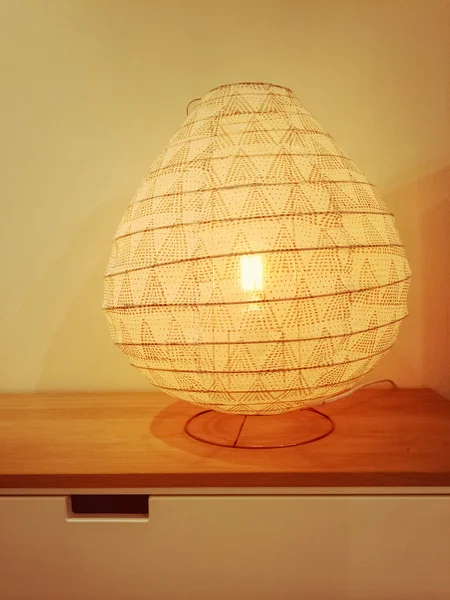 Cozy lamp giving warm yellow light — Stock Photo, Image