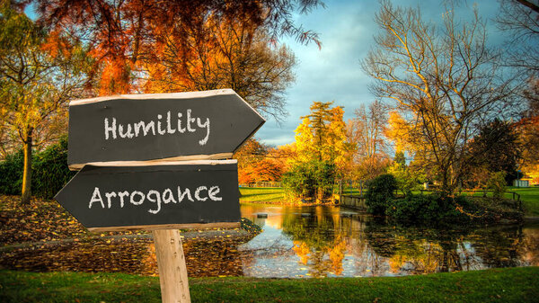 Street Sign the Direction Way to Humility versus Arrogance