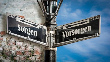 Almanca 'nın iki farklı yönünü gösteren işaret direği olan bir resim. Bir yön önlemlere, diğeri endişelere işaret eder..
