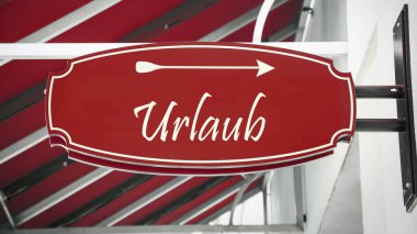 Tatil yönünü gösteren Almanca işaret levhası olan bir resim.