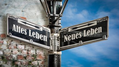 Almanca 'nın iki farklı yönünü gösteren işaret direği olan bir resim. Bir yön Yeni Hayat 'ı, diğeri Eski Hayat' ı gösteriyor..