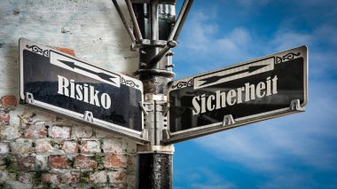 Almanca 'nın iki farklı yönünü gösteren işaret direği olan bir resim. Bir yön güvenliği gösterir, diğeri riski gösterir..