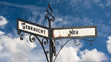 Almanca 'nın iki farklı yönünü gösteren işaret direği olan bir resim. Bir yön yeni, diğeri kullanılıyor..