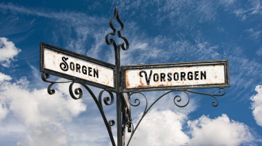 Almanca 'nın iki farklı yönünü gösteren işaret direği olan bir resim. Bir yön önlemlere, diğeri endişelere işaret eder..