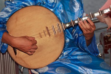 Musicians playing traditional instruments clipart