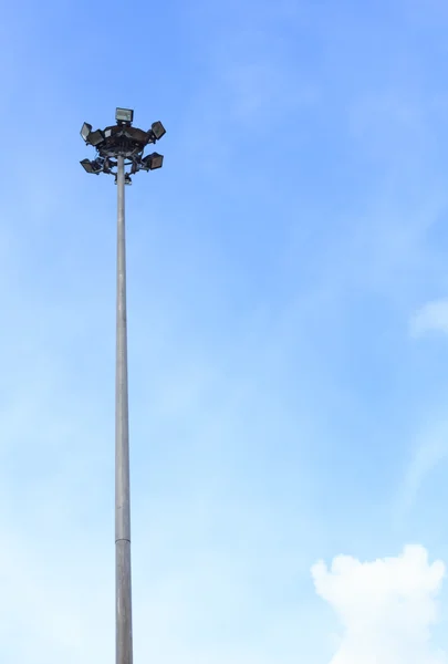 Pole spotlights with blue sky. — Stock Photo, Image