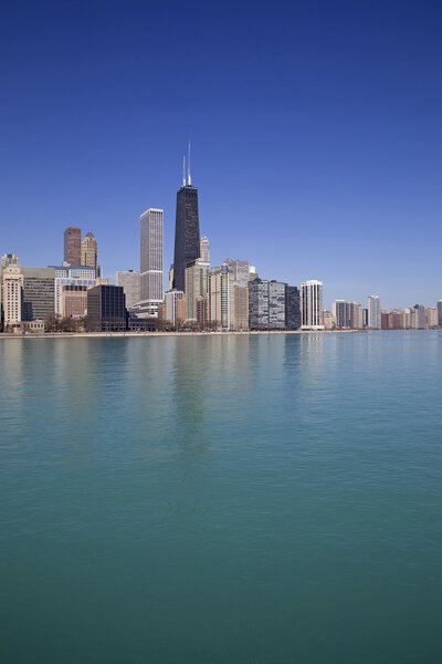 Skyline of Chicago city with buildings reflection on the lake