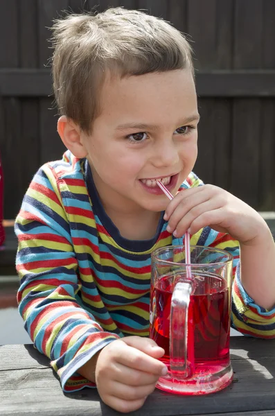 Child drinking lemonade — Stock Photo, Image