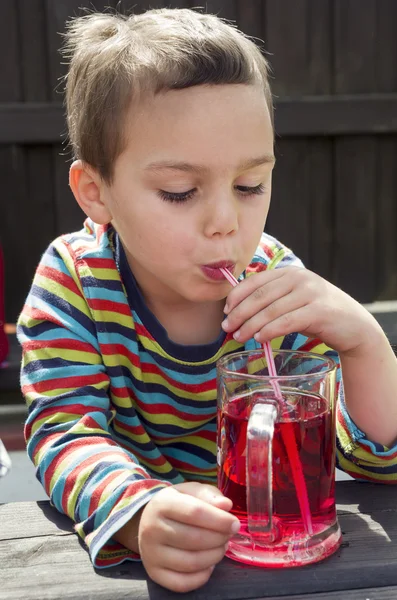 Child drinking lemonade — Stock Photo, Image