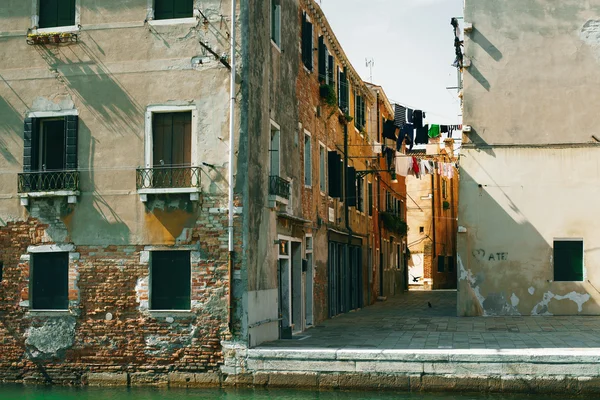 View to old building brick facade from the channel in Venice, Italy. — Stock Photo, Image