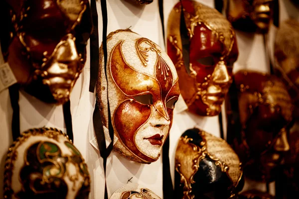 Venice, Italy - November 28, 2014: Selection of Venetian carnival masks.Masks were worn in Venice to disguise the wearer from illicit activities:gambling, dancing, affairs or even political assignation. — Stock Photo, Image