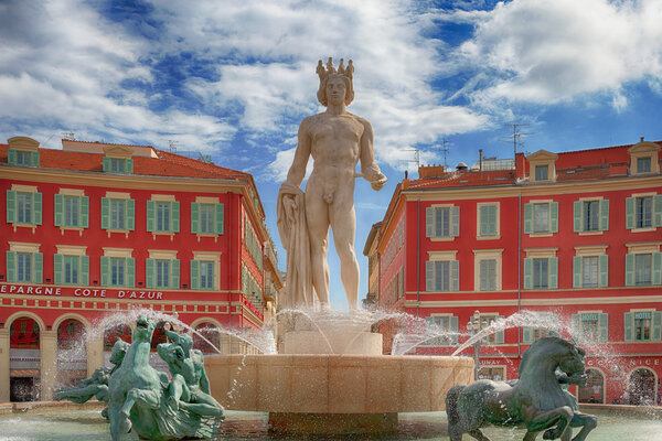 A view of the fountain Fontaine du Soleil at the Place Massena square in Nice, France