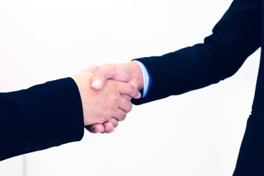 Beyaz arka plan üzerinde izole businessmans el sıkışma closeup.