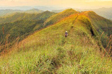 Woman hikers going to the top of the mountain, Khao Chang Puak Thailand.