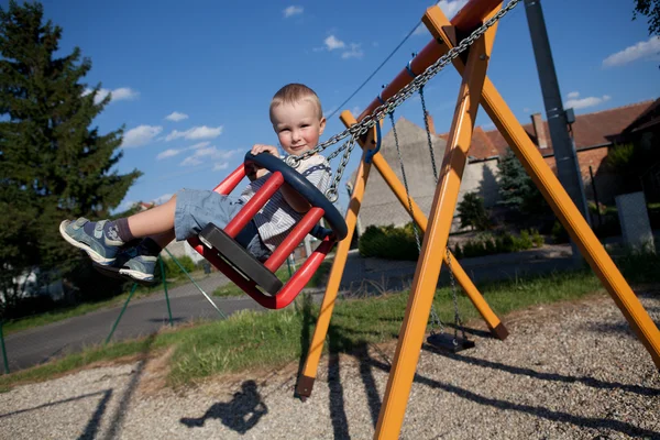 Boy on a swing — Stock Photo, Image